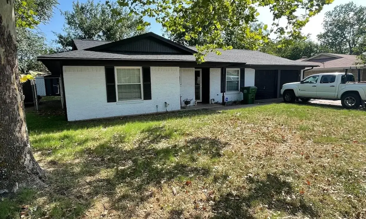Professional roofing crew working on a residential roof in Gulf Park Estates
